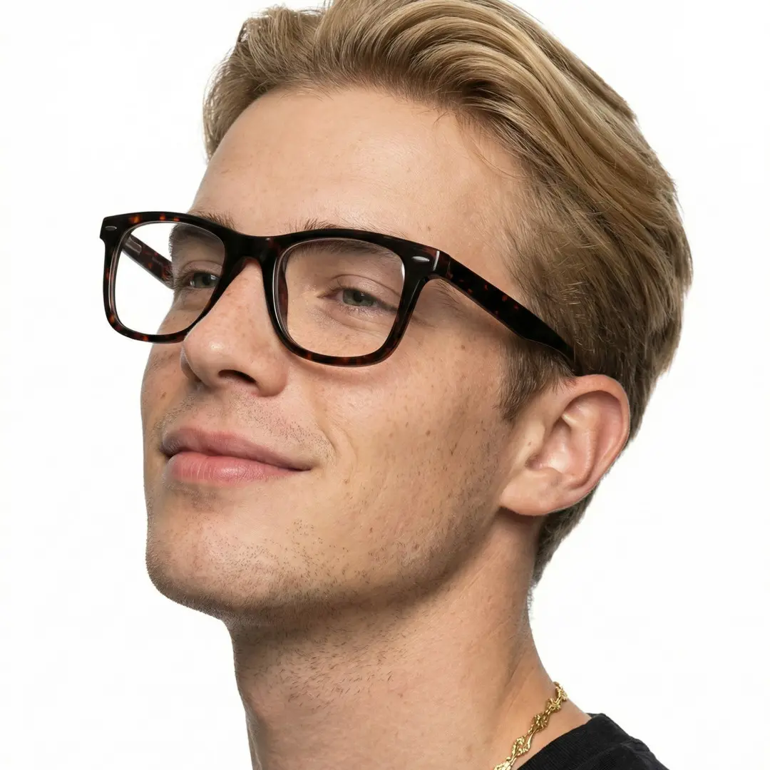 Looking away view of male wearing tortoise square eyeglasses, neutral expression, SP0112409