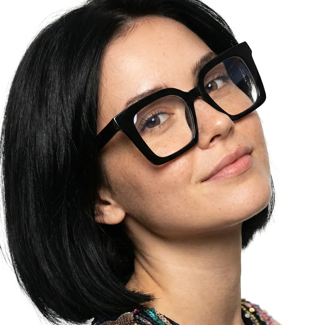 Over-the-shoulder view of female wearing black square eyeglasses, natural expression, SP0132508