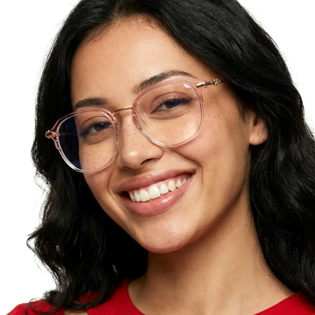Three-quarter view of female wearing pink square eyeglasses, tilting head, smiling, SR0012502