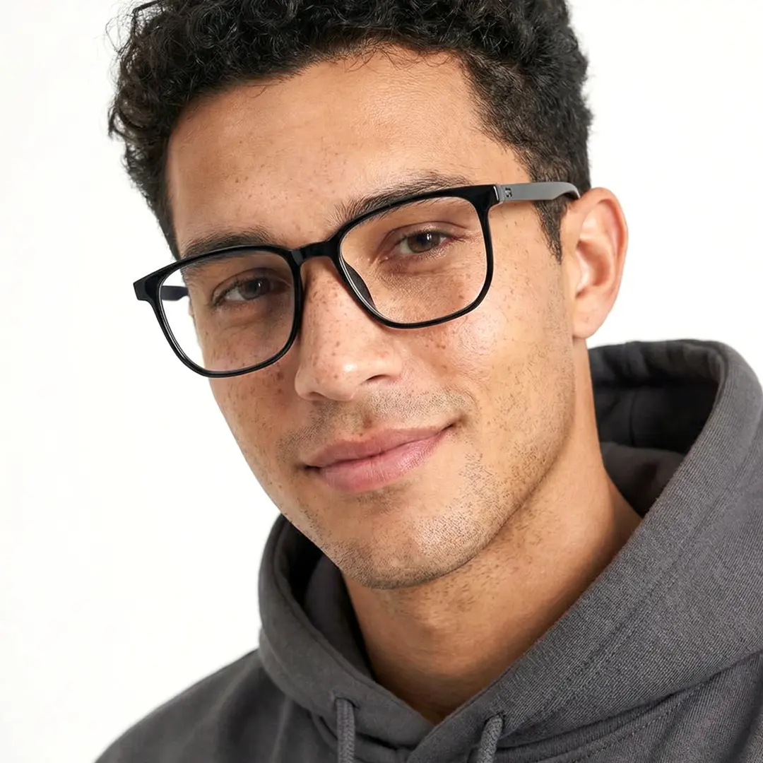 Front view of male wearing black square eyeglasses, friendly smile, SR00162508