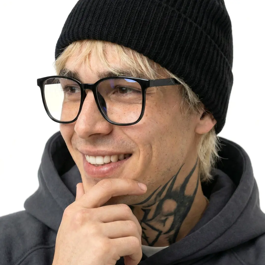 Three-quarter view of male wearing black square eyeglasses, smiling, SR00162508