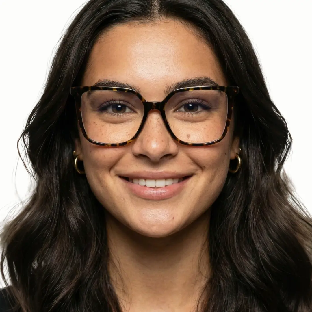 Front view of female wearing tortoise square eyeglasses, smiling, SR0022510