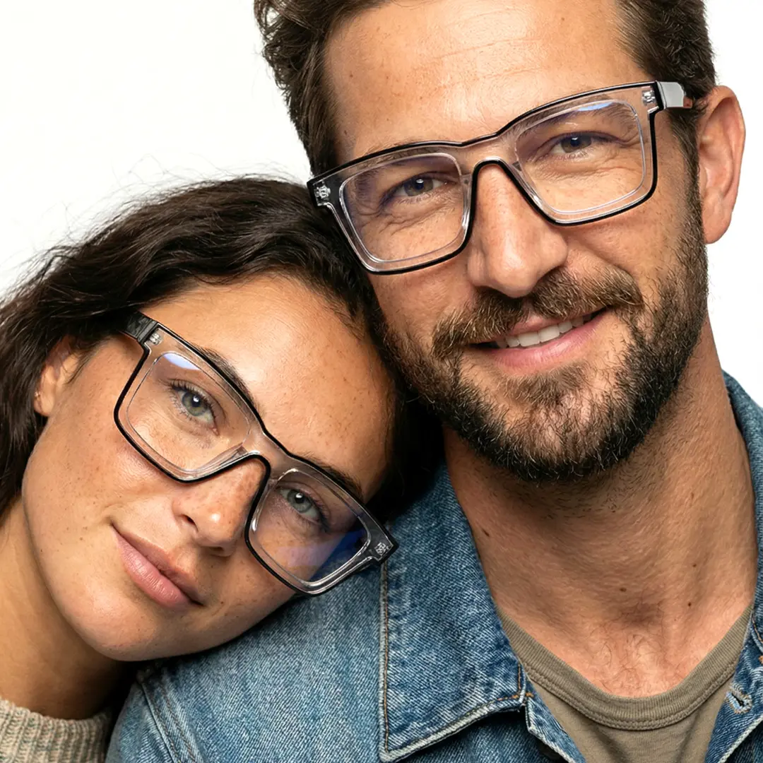 Front view of couple wearing clear square eyeglasses, smiling, SR0032307