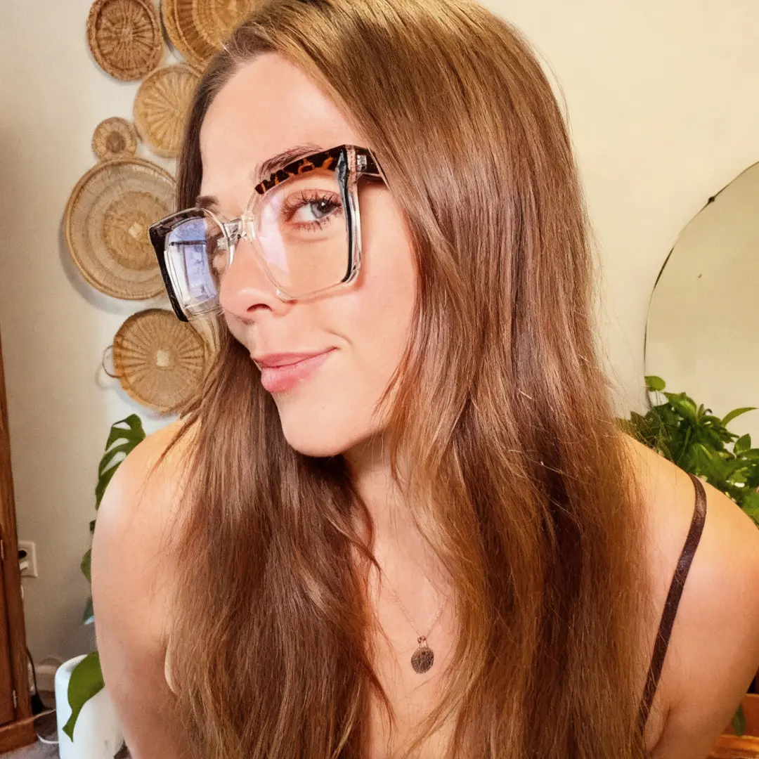 Profile view of female wearing colorful black square eyeglasses, neutral expression, SR0032502