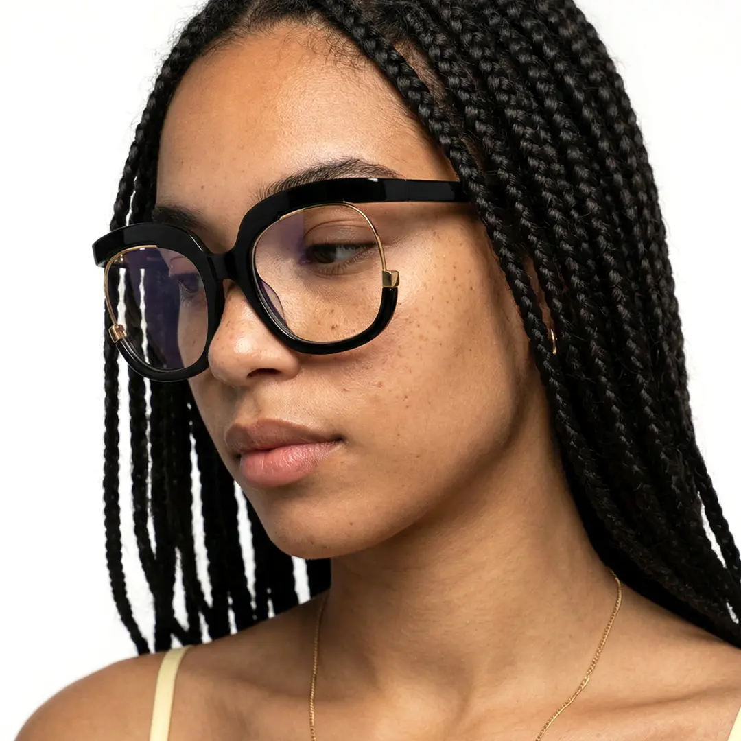Looking away view of female wearing colorful black square eyeglasses, calm expression, SR0042502