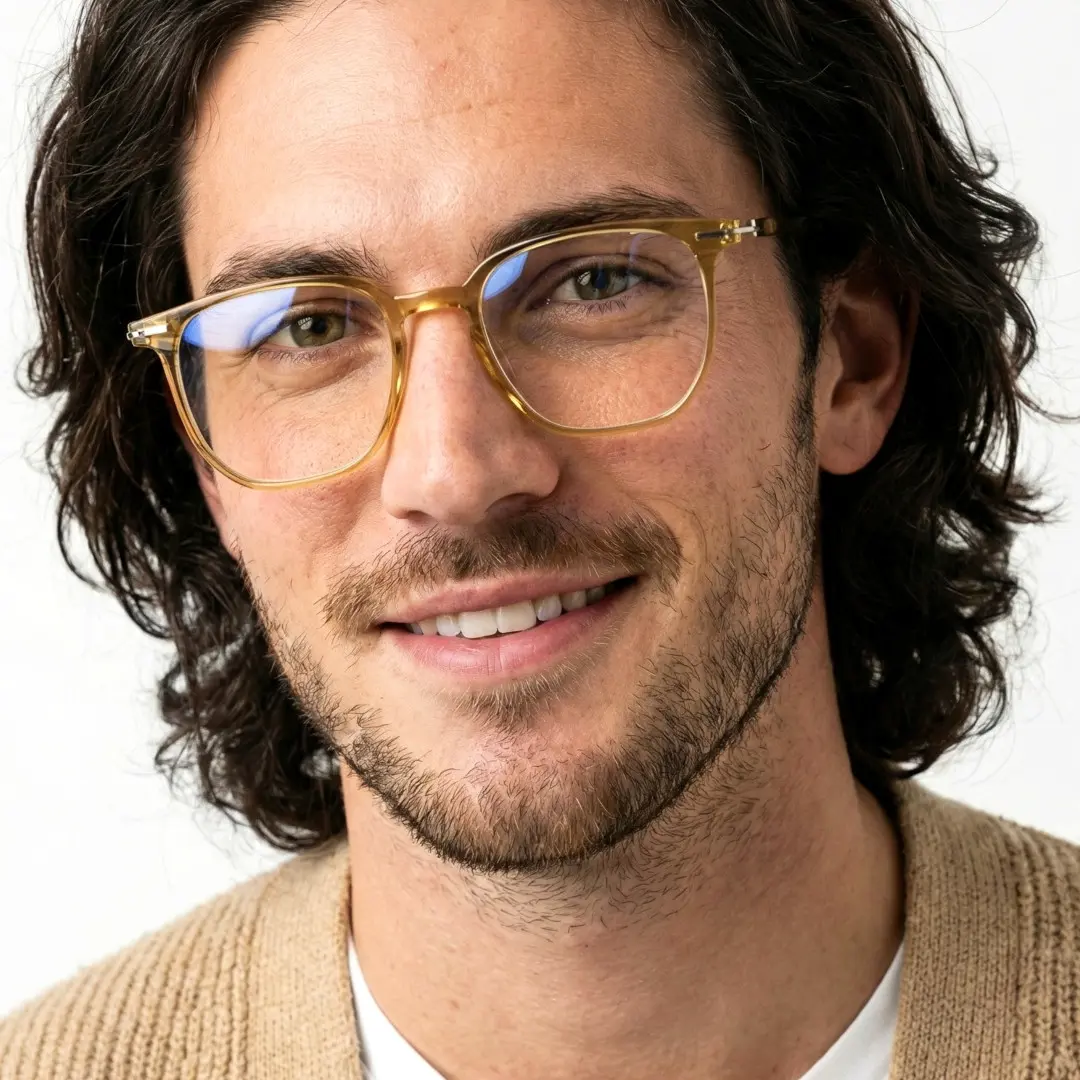 Front view of male wearing green square eyeglasses, natural smile, SR0042508