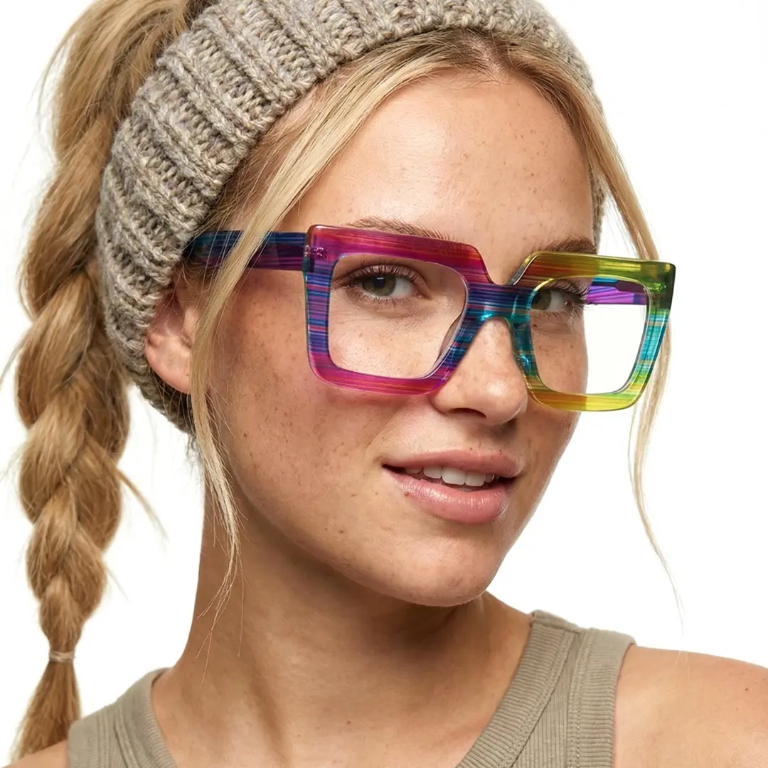 Face close-up view of female wearing multicolor square eyeglasses, soft smile, SR0062509