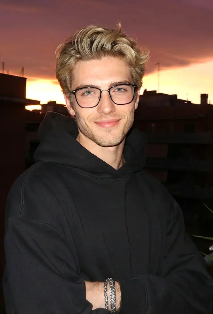 Male model wearing everyday glasses black square tr90 eyeglasses on a sunset rooftop. SPU: SR0092409