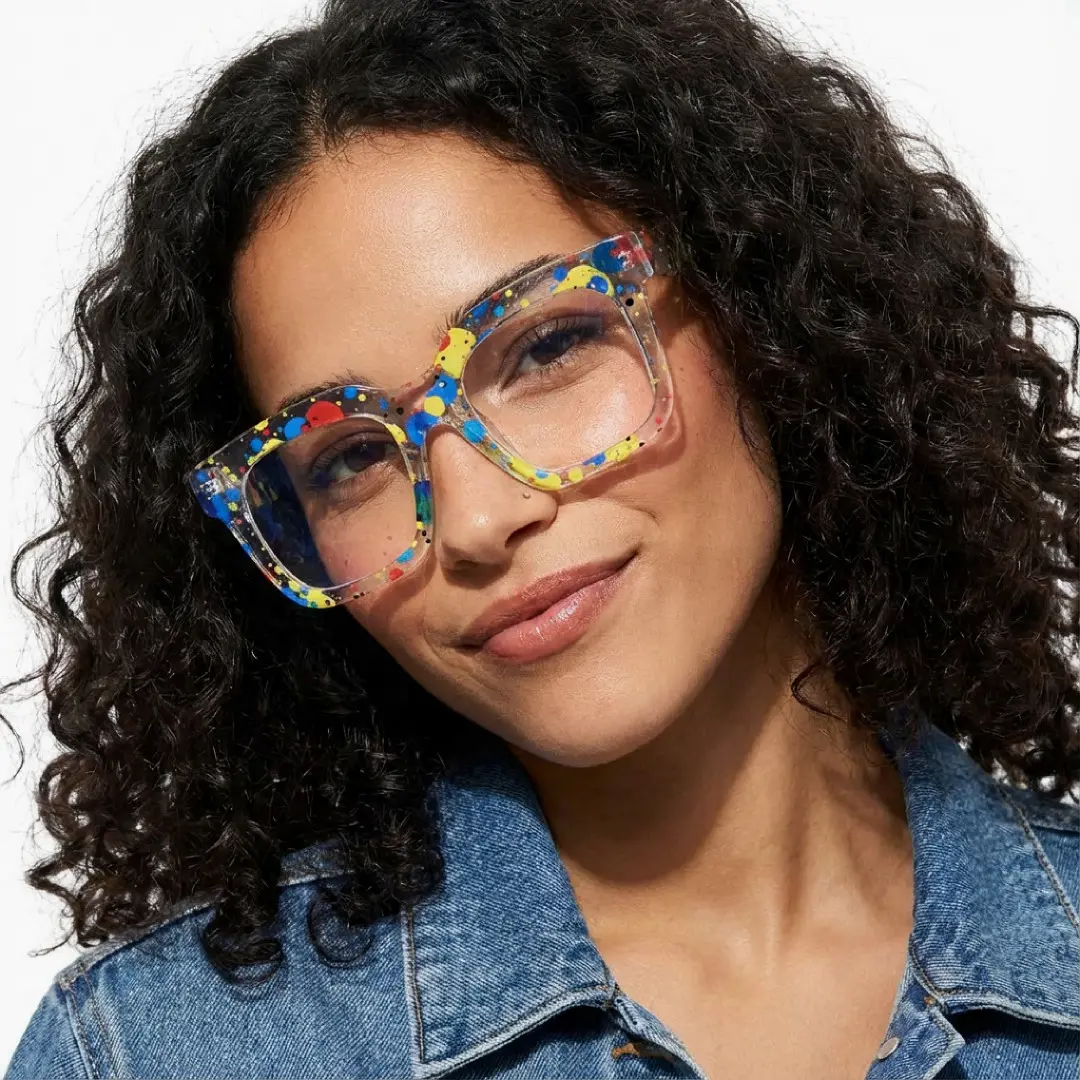 Tilted head view of female wearing multicolor square eyeglasses, neutral expression, SR0112509