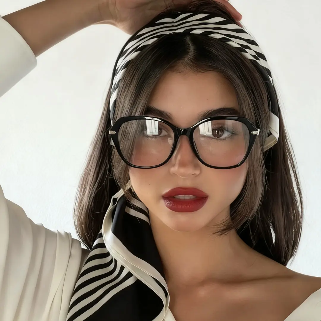 Straight-on view of female wearing black square eyeglasses, hand in hair, various expressions, SR0132509