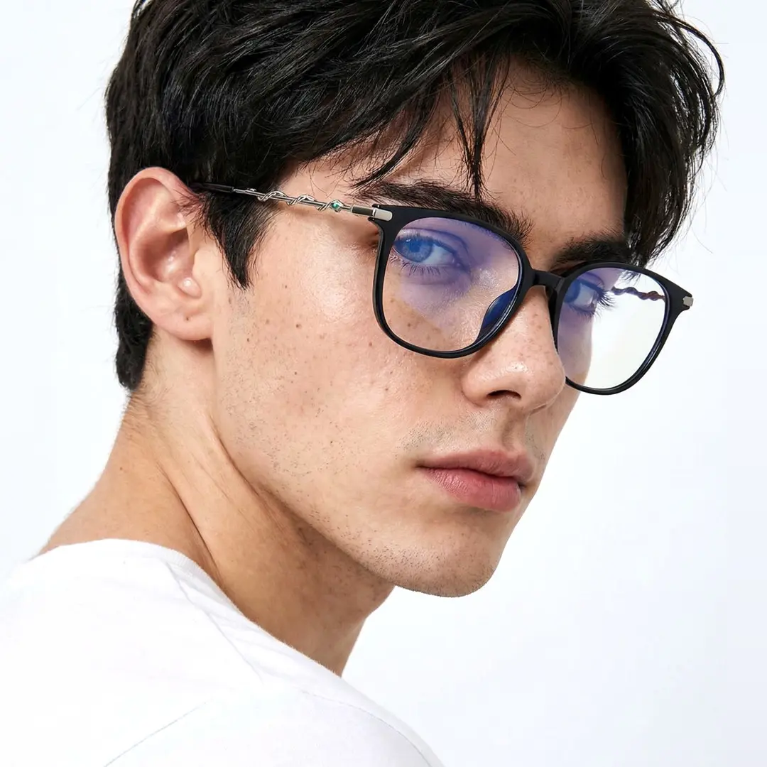 Over-the-shoulder view of male wearing black square eyeglasses, calm expression, SR0162601