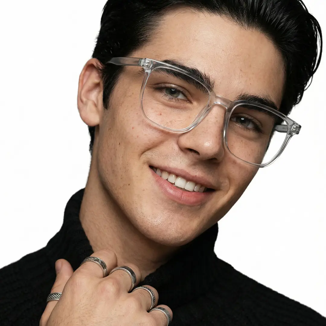 Tilted head view of male wearing grey square eyeglasses, natural smile, SR0172409