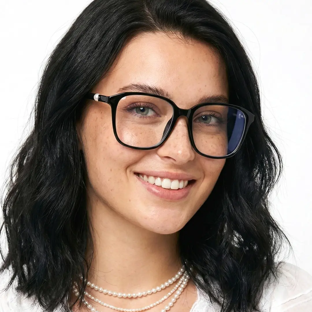Three-quarter view of female wearing black square eyeglasses, smiling, SR0182509