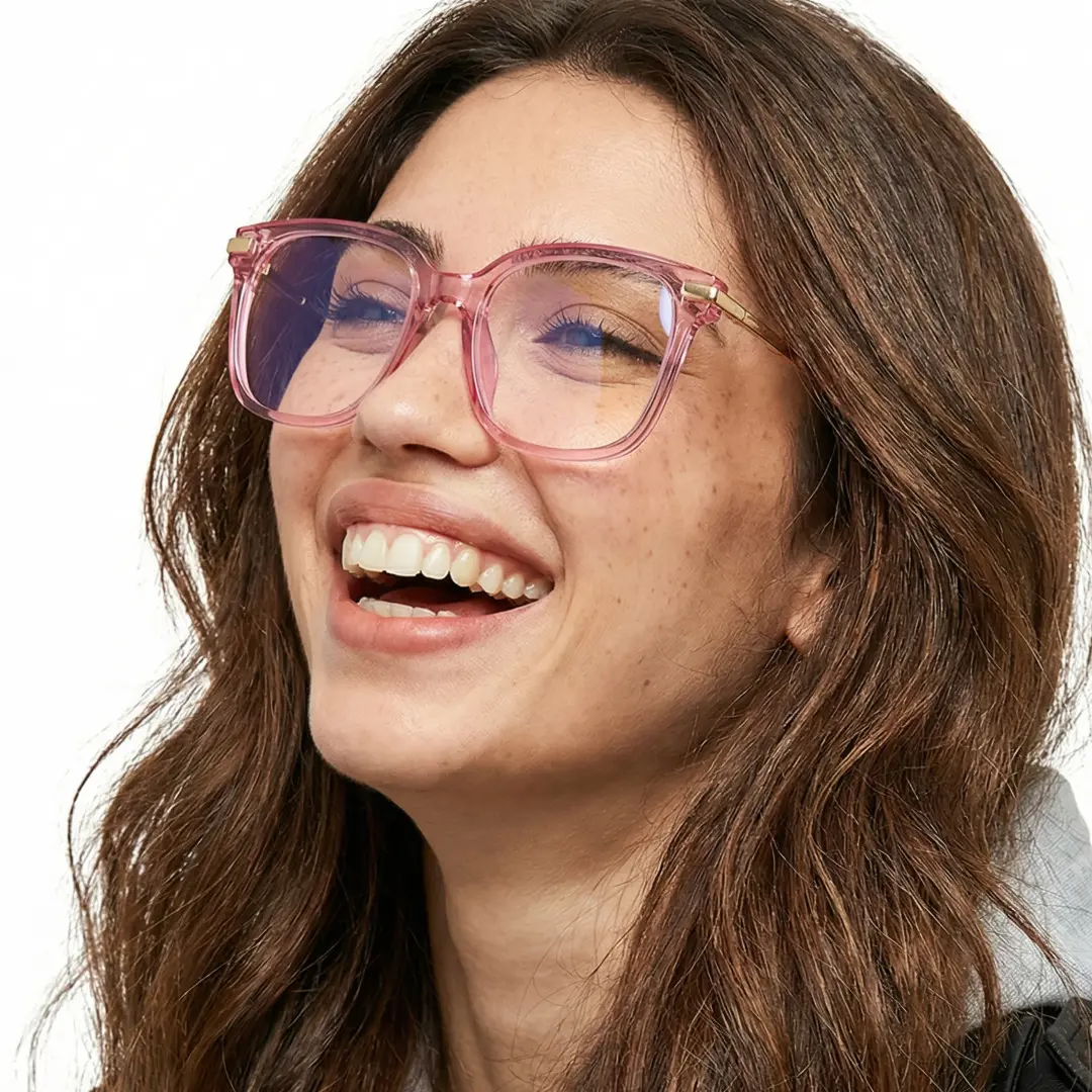 Three-quarter view of female wearing pink square eyeglasses, smiling, SR0192502