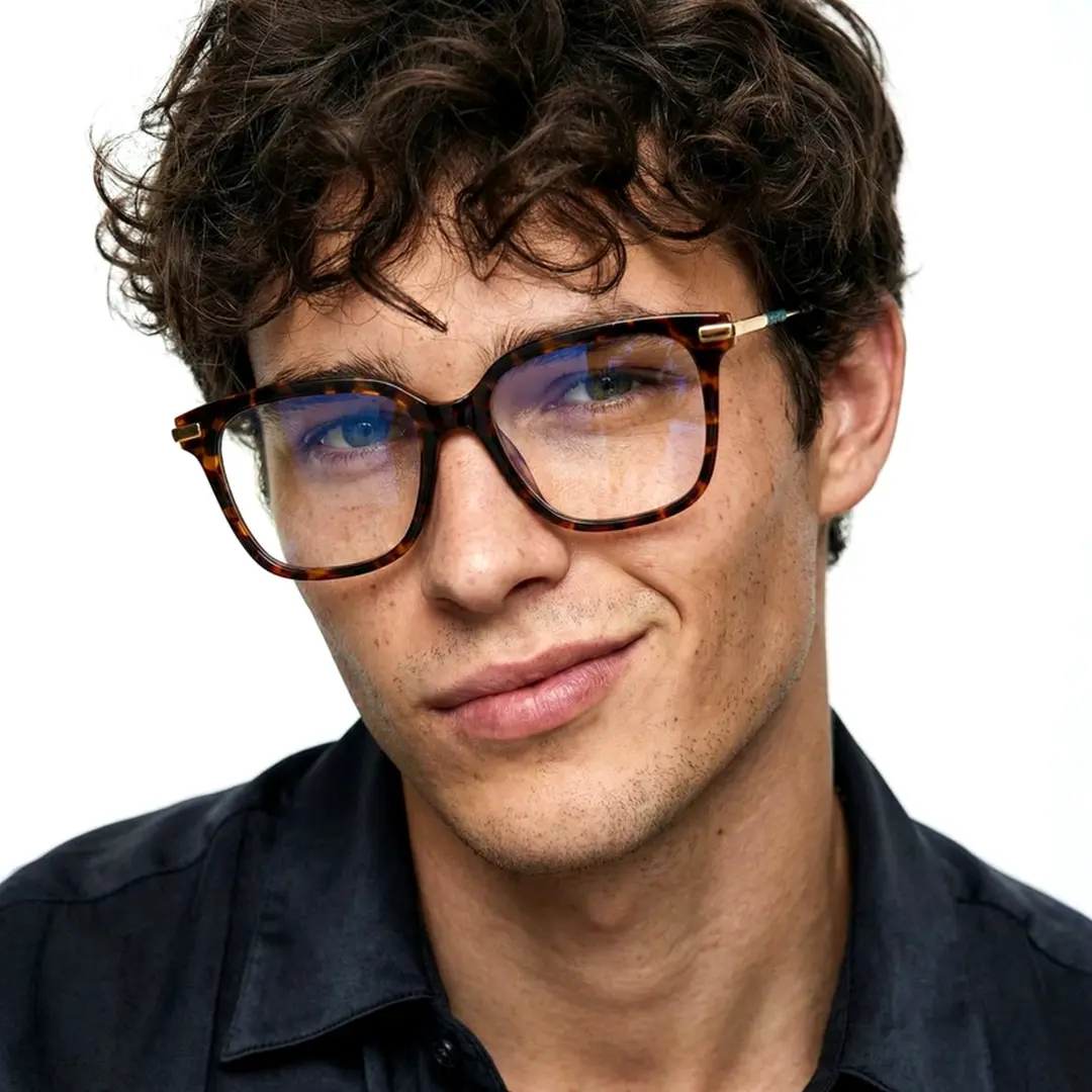 Front view of male wearing tortoise square eyeglasses, friendly smile, SR0192502