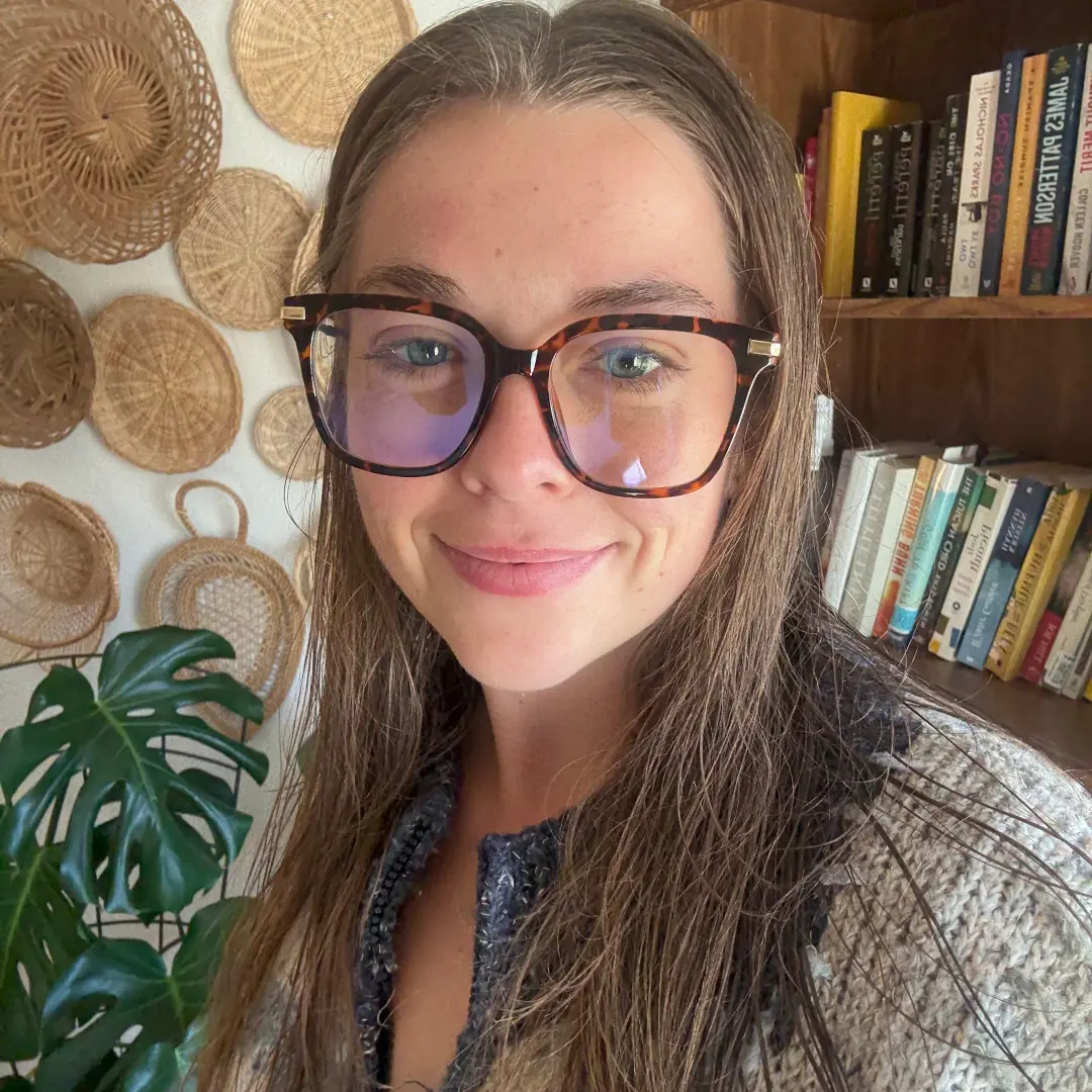 Front view of female wearing tortoise square eyeglasses, soft smile, SR0192502