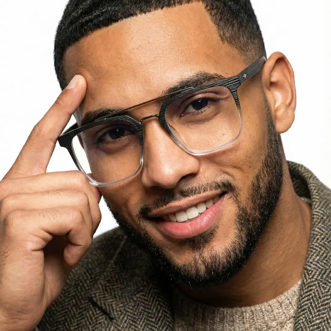 Looking straight ahead view of male wearing two-tone square eyeglasses, hand resting on forehead, natural smile, SR0222508