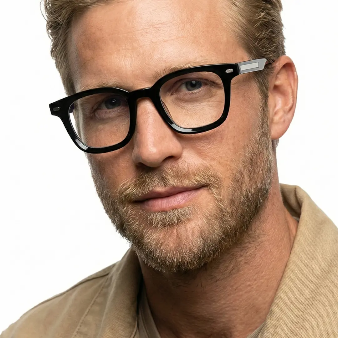 Close-up view of male wearing black square eyeglasses, neutral expression, SR0262508