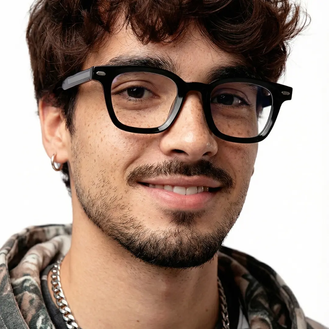 Three-quarter view of male wearing black square eyeglasses, natural smile, SR0262508