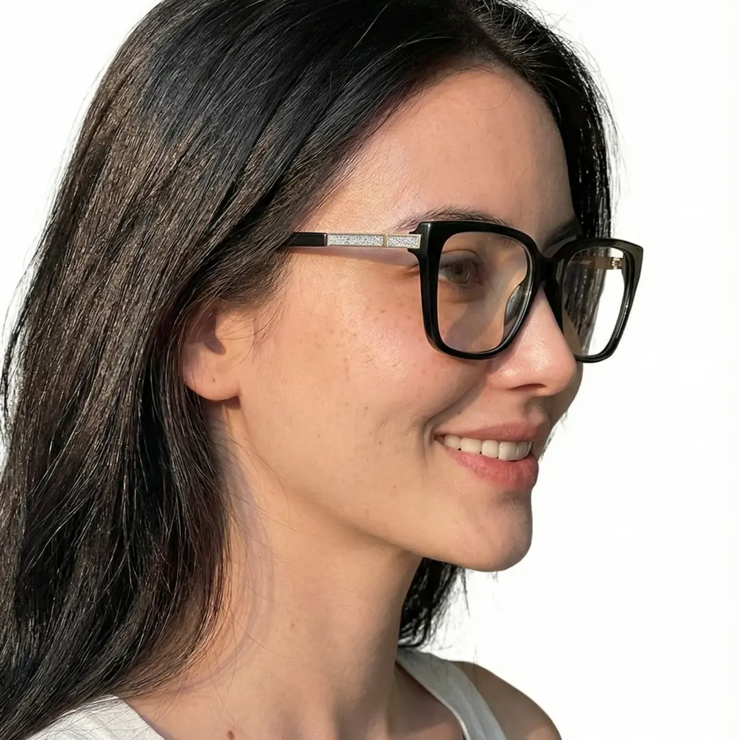 Looking away view of female wearing black square eyeglasses, soft smile, SR0312508