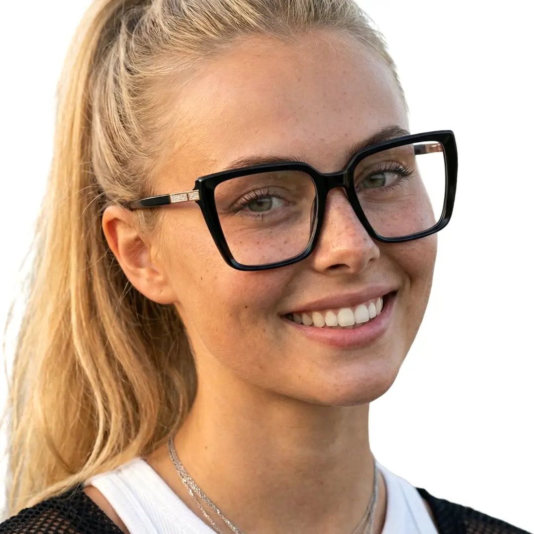 Three-quarter view of female wearing black square eyeglasses, smiling, SR0312508
