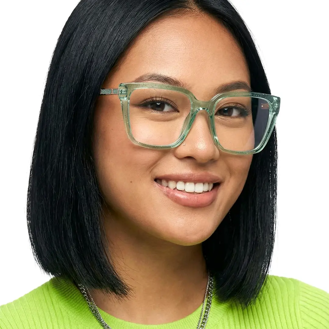 Slightly angled view of female wearing green square eyeglasses, smiling, SR0312508