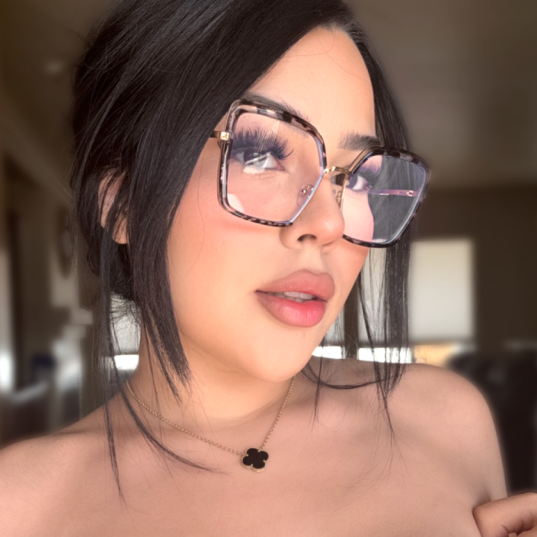 Face close-up view of female wearing tortoise square eyeglasses, relaxed expression, SR0332503