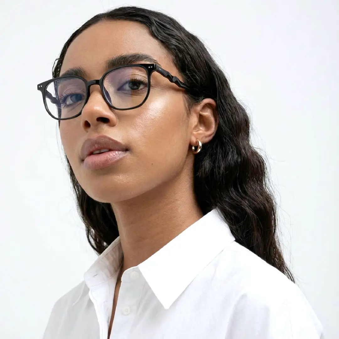 Three-quarter view of female wearing black square eyeglasses, natural expression, SR0342509