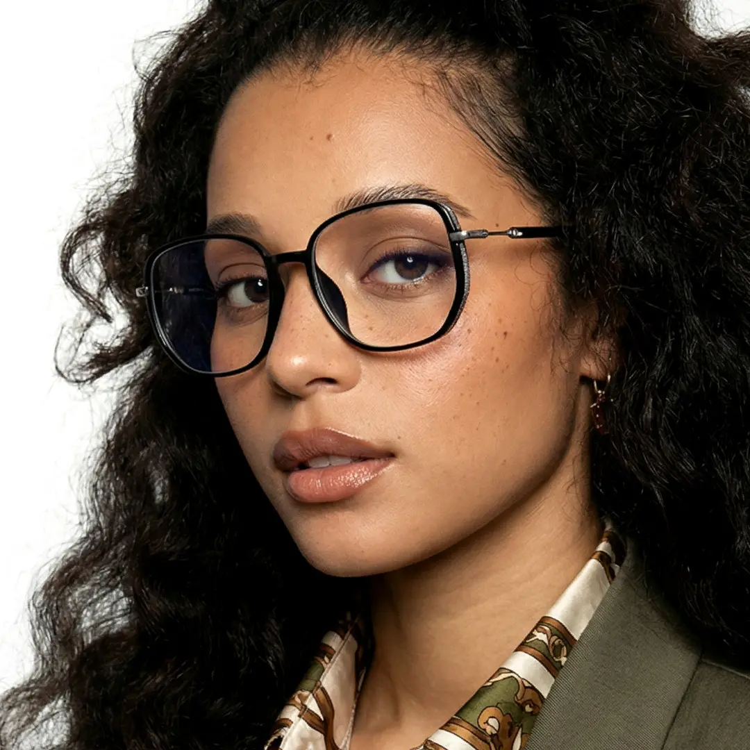 Profile view of female wearing vintage black square eyeglasses, natural expression, SR0992509