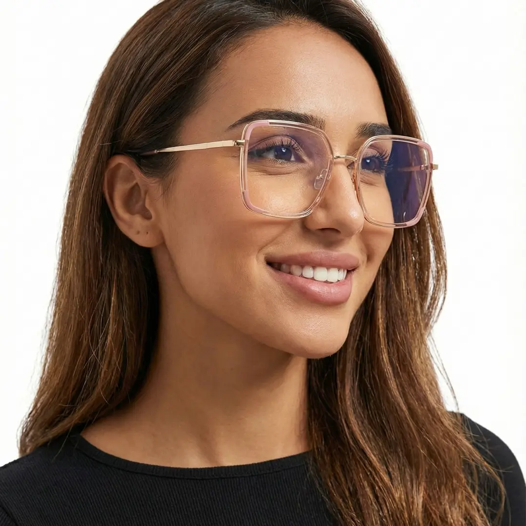 Three-quarter view of female wearing pink square eyeglasses, smiling, SX0302508