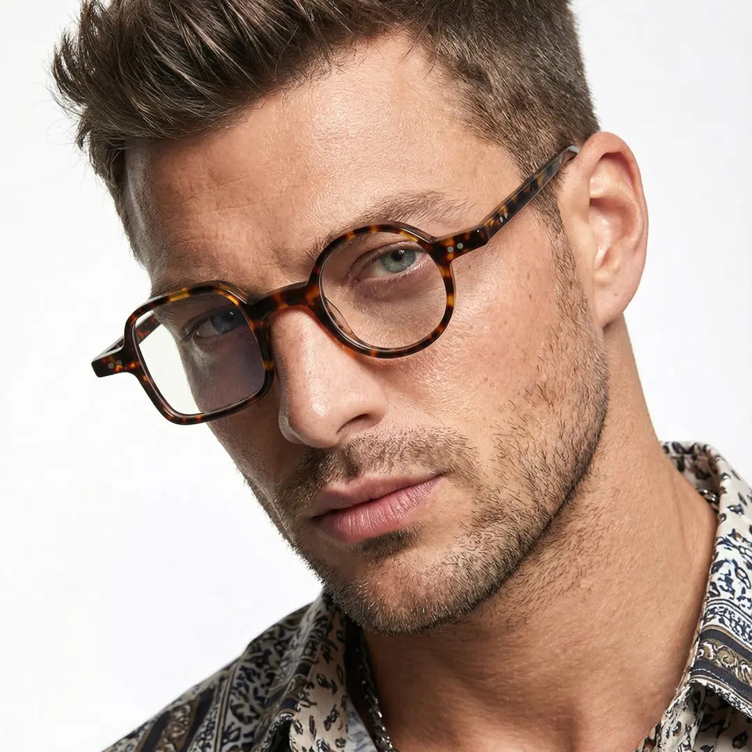 Three-quarter view of male wearing tortoise unique eyeglasses, neutral expression, UA0042001