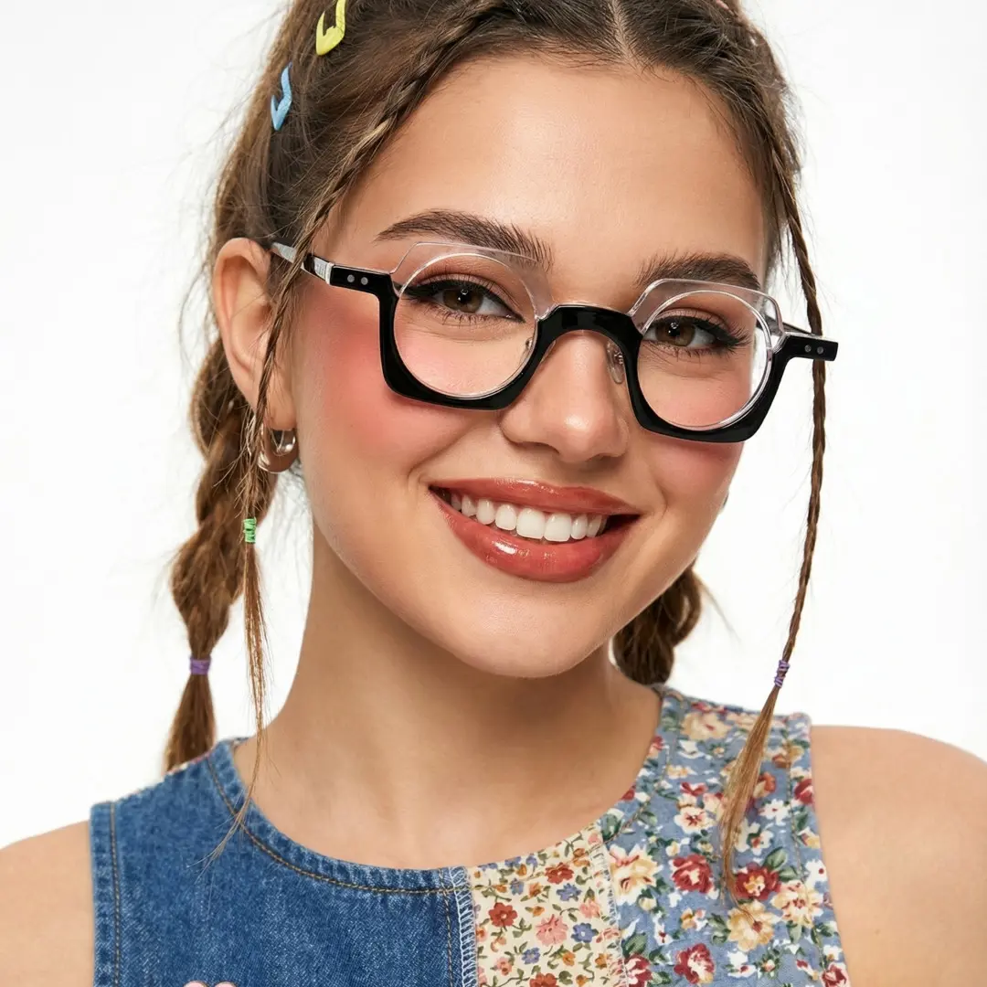 Front view of female wearing black unique eyeglasses, tilting head, smiling, UA0052302