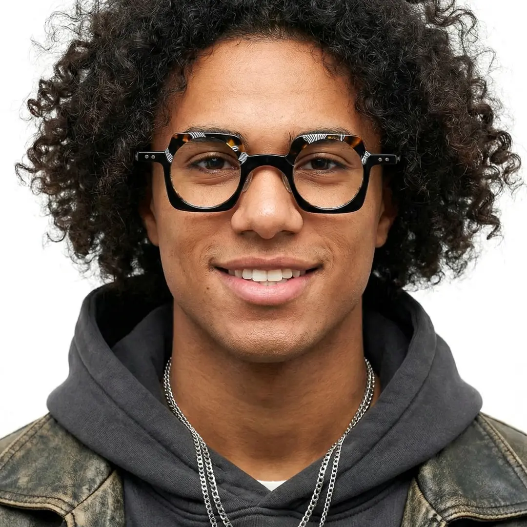 Front view of male wearing blue tortoise unique eyeglasses, friendly smile, UA0052302