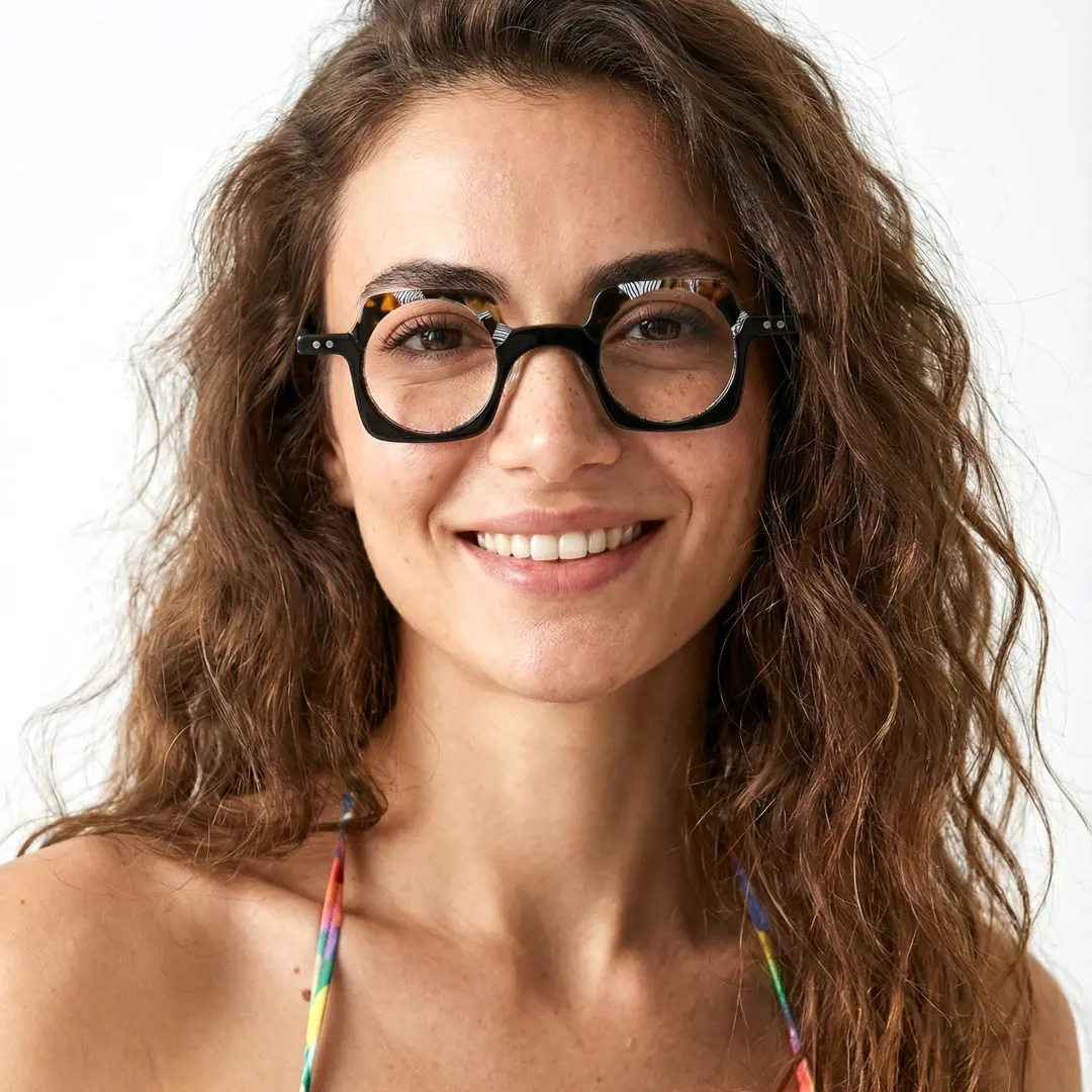 Front view of female wearing blue tortoise unique eyeglasses, natural smile, UA0052302
