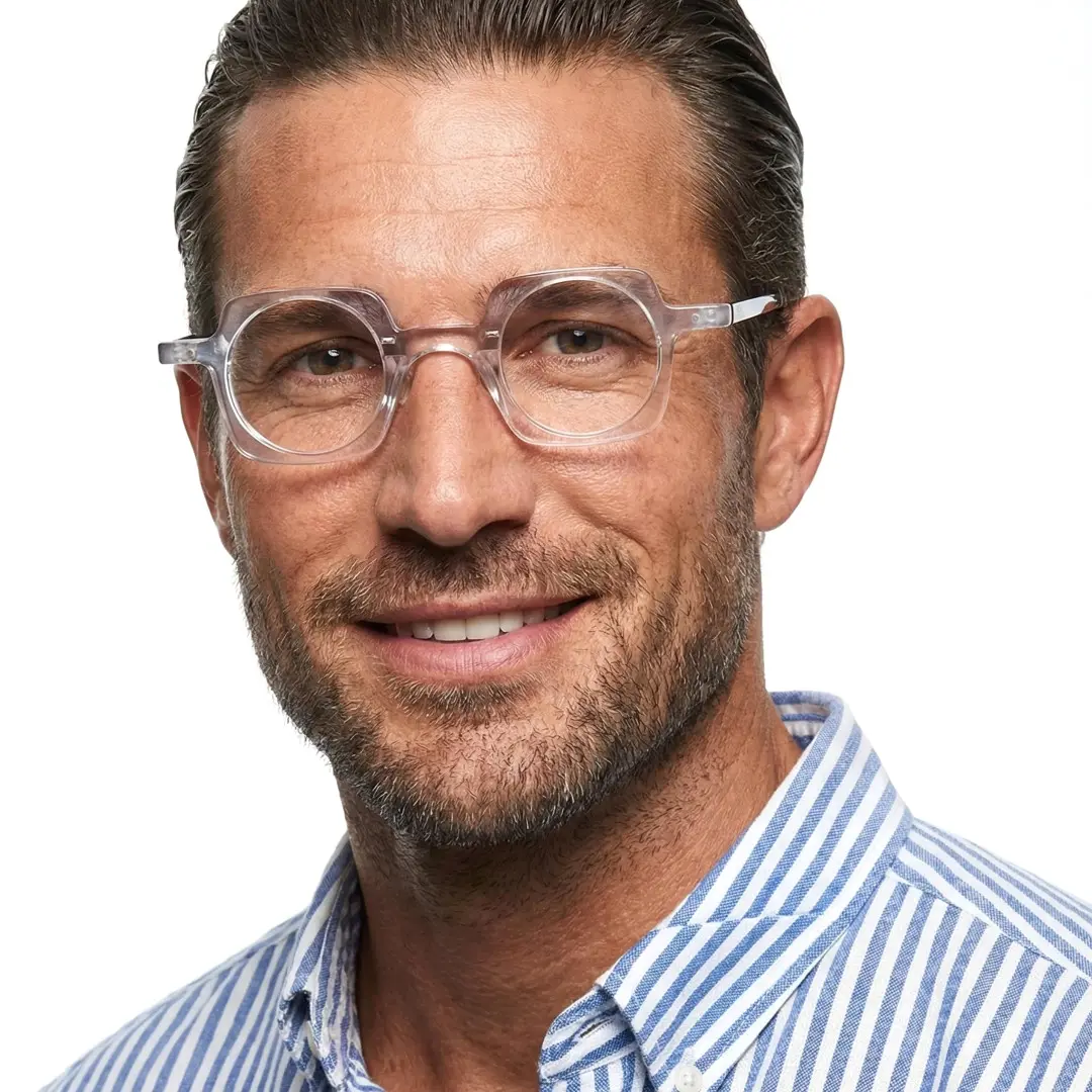 Front view of male wearing clear unique eyeglasses, natural smile, UA0052302