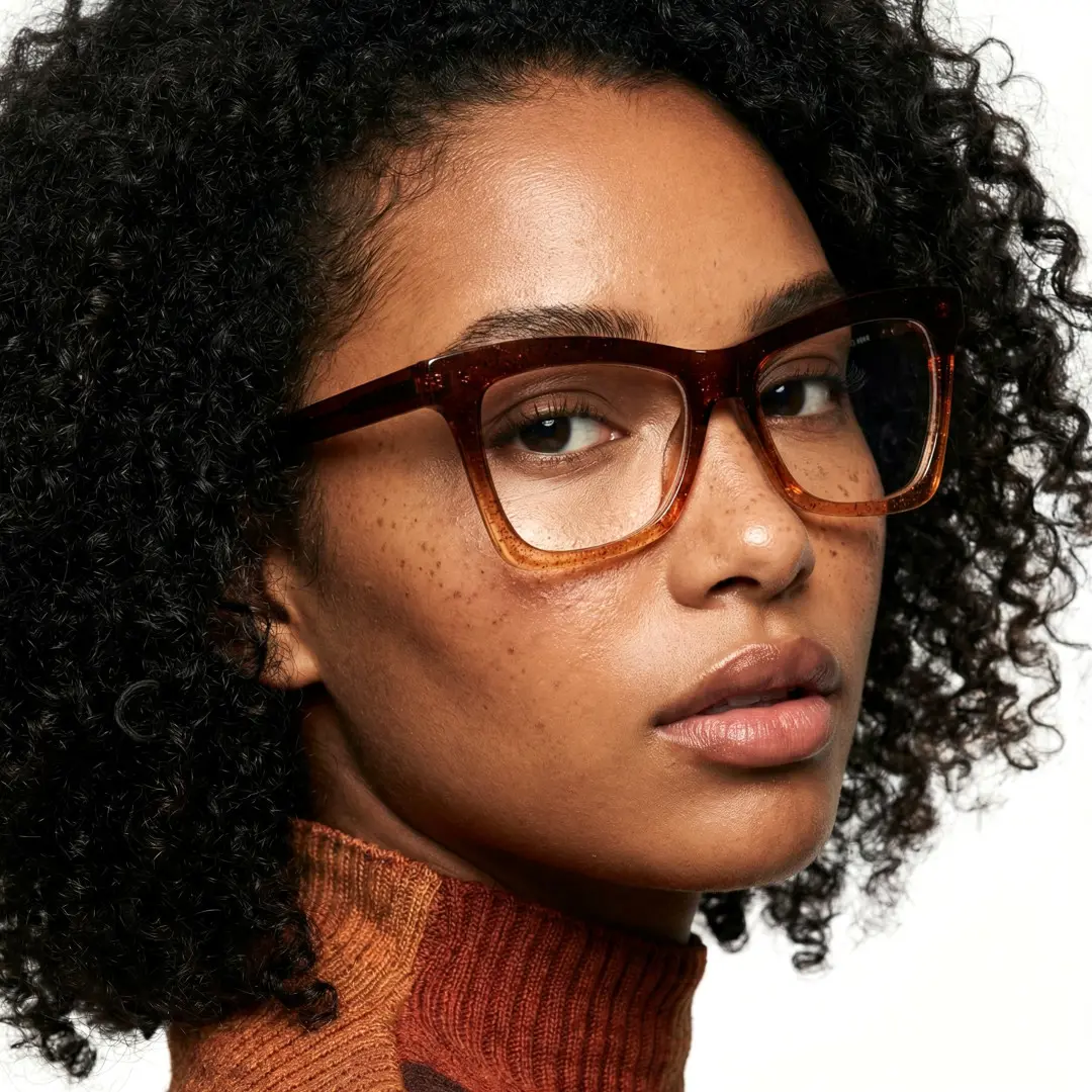 Over-the-shoulder view of female wearing brown butterfly eyeglasses, natural expression, UR0152502