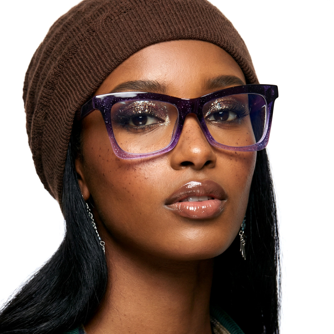 Front view of female wearing purple butterfly eyeglasses, neutral expression, UR0152502