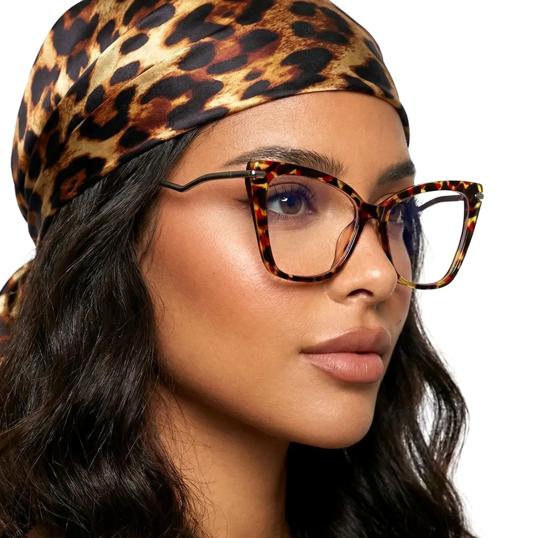 Looking away view of female wearing tortoise butterfly eyeglasses, natural expression, UR0172502