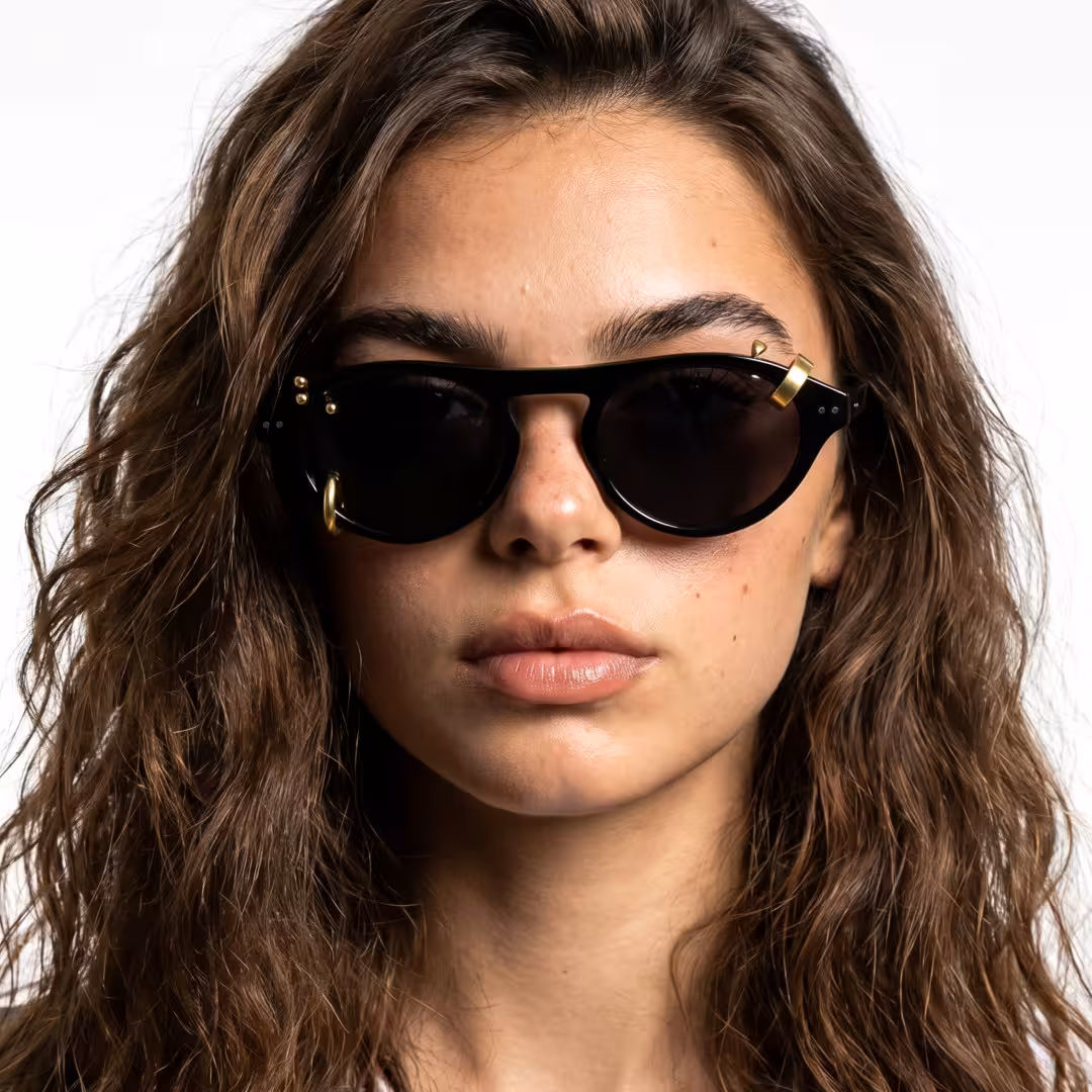 Front view of female wearing gold aviator handcrafted polarized sunglasses, natural expression, AA0062604