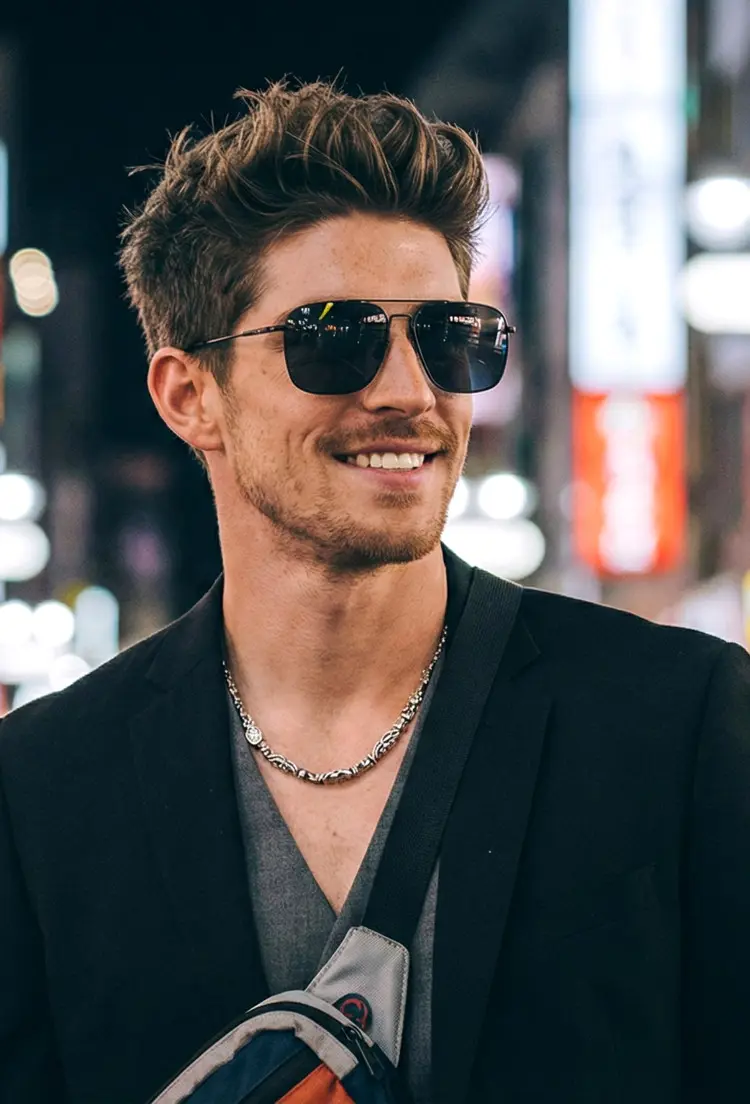 Male model wearing vintage black aviator metal sunglasses in a vibrant night city. SPU: AM0052603