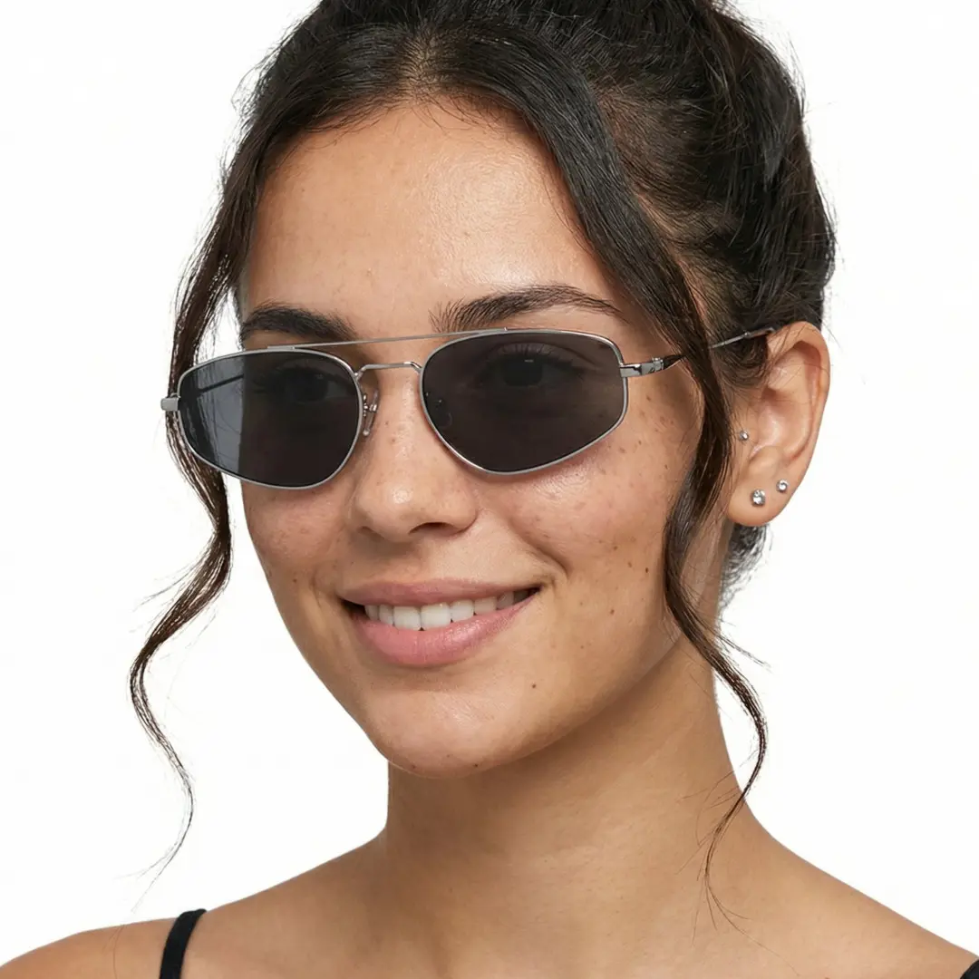 Three-quarter view of female wearing silver aviator sunglasses, friendly smile, AM0082603