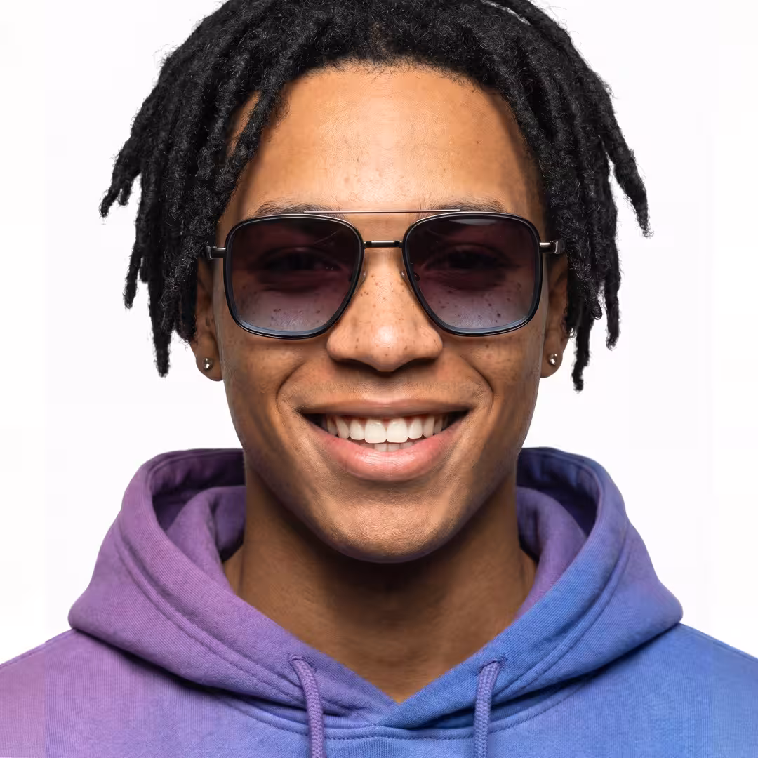Front view of male wearing vintage gray aviator sunglasses, natural smile, AM0242603