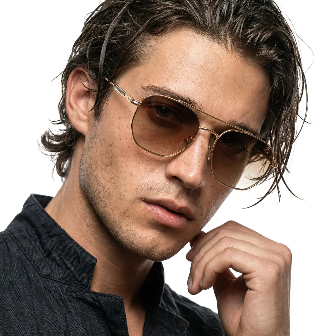 Front view of male wearing brown aviator sunglasses, tilting head, neutral expression, AM0302505