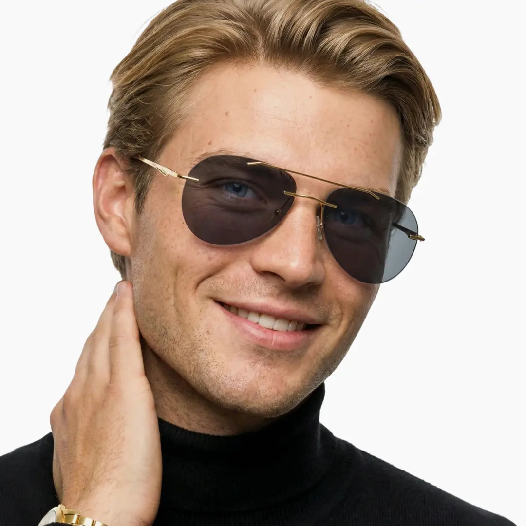 Profile view of male wearing gold aviator sunglasses, hand touching shoulder, smiling, AM0492506S