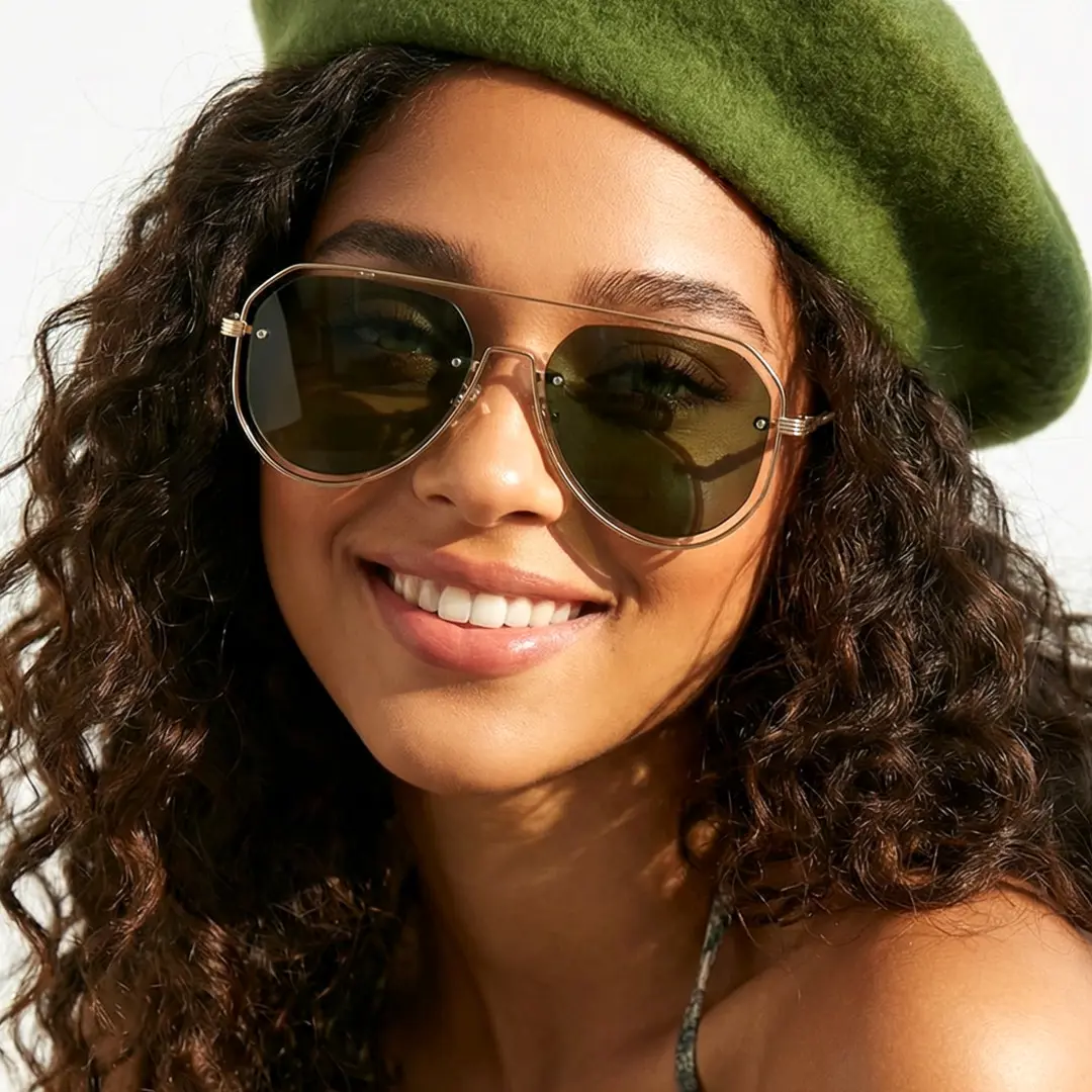 Front view of female wearing vintage green aviator sunglasses, smiling, AP0022505