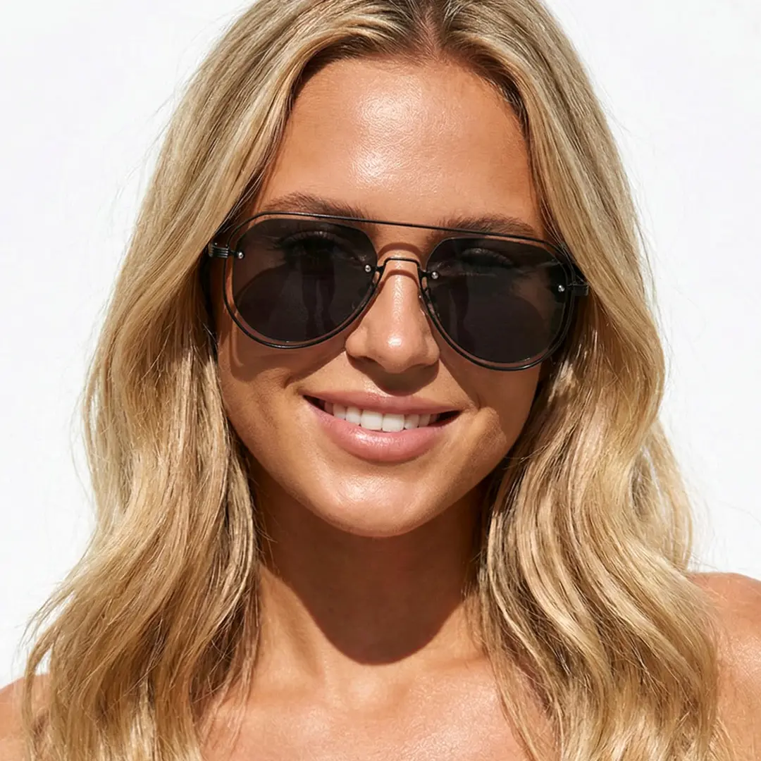 Front view of female wearing vintage grey aviator sunglasses, natural smile, AP0022505