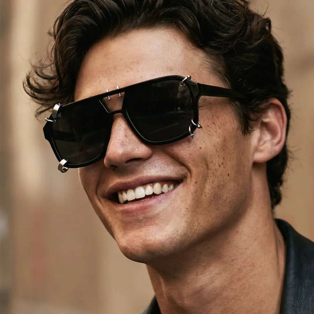 Profile view of male wearing black aviator handcrafted polarized sunglasses, smiling, AP0052511
