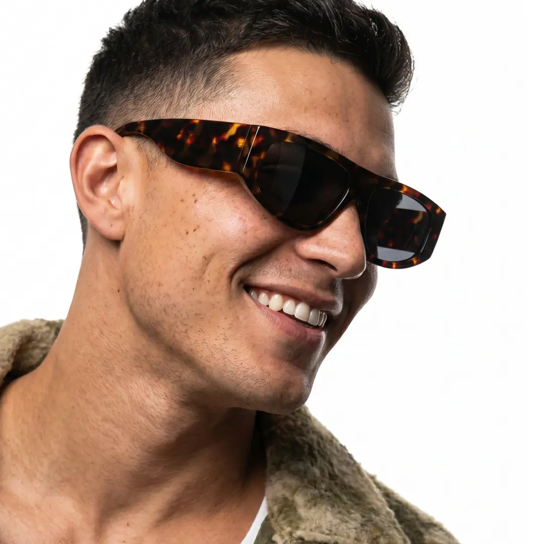 Profile view of male wearing fashion vintage tortoise aviator sunglasses, tilting head, big smile, AP0092604