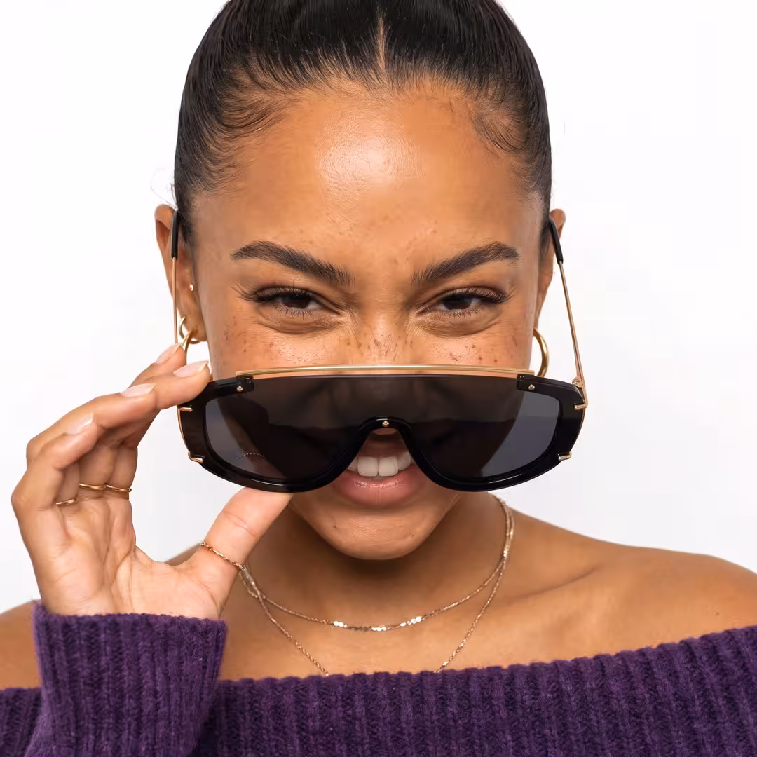 Female wearing fashion black aviator pc sunglasses, smiling while adjusting glasses. SPU: AP0302605