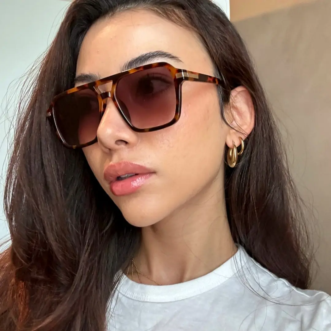 Profile view of female wearing tortoise aviator sunglasses, neutral expression, AP0502506